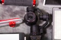 Close up of an Osmo Mobile gimbal, new generation of electronic stabilizer over a gray background