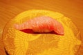 Close up of otoro tuna sushi nigiri on plate in sushi belt japan restaurant. Royalty Free Stock Photo