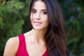 Close up outdoor portrait of young beautiful brunette woman with green eyes and long healthy hair. Royalty Free Stock Photo