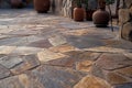 A close-up of an outdoor stone pathway with irregularly porphyry slabs, multicolored stones Royalty Free Stock Photo