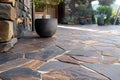 A close-up of an outdoor stone pathway with irregularly porphyry slabs, multicolored stones Royalty Free Stock Photo