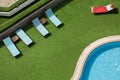 Close up outdoor swimming pool and pool chairs with clear clean