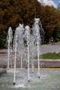 Close up outdoor view in the night of a public fountain with many small water jets. Abstract natural image with pattern Royalty Free Stock Photo