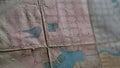 Close-up of outline map details. Stock footage. Details of marked area on contour map. Old contour map with markers and