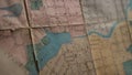 Close-up of outline map details. Stock footage. Details of marked area on contour map. Old contour map with markers and