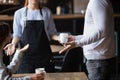 Close up outraged customers arguing with waitress, bad service concept Royalty Free Stock Photo