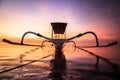 Close up of an outrigger boat, traditional fishing boat, Jukung from Bali Indonesia, on the beach in front of Sanur in the morning Royalty Free Stock Photo