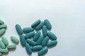 Close-up. Oval light green tablets on a white background Royalty Free Stock Photo