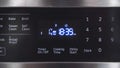 Close up of oven display flickering, control panel blinking. Electricity problem Royalty Free Stock Photo