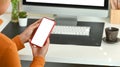 Businesswoman using mobile phone at office desk. Royalty Free Stock Photo