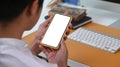 Close up young man holding mock up smart phone with empty screen. Royalty Free Stock Photo