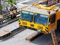 Close-up of Over Size Load portable Crane with broken window