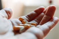 Close up hand of woman overdosing on medication.