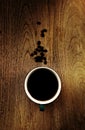 Close up overhead view of a cup of strong frothy espresso coffee