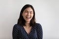 Overjoyed Asian girl laugh at funny joke Royalty Free Stock Photo