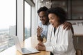 Close up overjoyed surprised African American couple reading good news Royalty Free Stock Photo