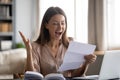 Close up overjoyed woman reading good news in letter Royalty Free Stock Photo