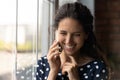 Close up overjoyed woman talking on phone, having pleasant conversation