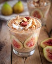 Close-up of oats and chia seeds pudding with figs, on wooden background Royalty Free Stock Photo