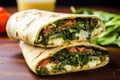 close-up of an overstuffed greek feta wrap