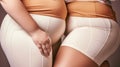 Close up of an overweight two women in tight clothes., plus size female waistline, belly, body positivity