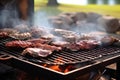 close-up of oysters on a beach bbq grill with smoke rising