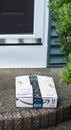 Close up of a package left on front stoop of a home Royalty Free Stock Photo