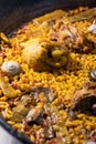 Close up for paella Valenciana in iron skillet