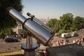 Close-up of a paid telescope to explore the city from the Montmartre hill near the walls of the Sacre Coeur Basilica in Paris Royalty Free Stock Photo