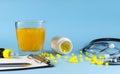 Close-up of painkiller pills in a glass of water