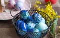 Close up of painted Easter eggs in a metal basket Royalty Free Stock Photo