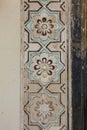 Close up of the painted floral motifs at the entrance of the Qutub Shahi Tombs in Hyderbad, Telangana, India