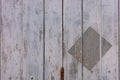 Close up on painted grey wooden wall with rectangle stamped