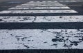 close up of painted lines on asphalt on a pedestrian crossing zebra crosswalk Royalty Free Stock Photo