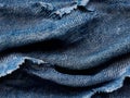 A close up of a pair of blue jeans with holes in it Royalty Free Stock Photo