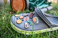 Close-up of a pair of gray foam Crocs in the grass and Jibbitz decorations Royalty Free Stock Photo