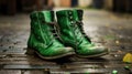 Close up of a pair of green boots standing on the street on the cobblestones, celebrating St. Patrick\'s Day during the Irish