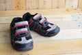 Close up of a pair of kids sport shoes on wood panels Royalty Free Stock Photo