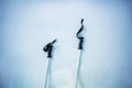 Details shot of a mountain ski poles pair in the snow from above