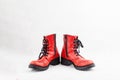 Pair of old leather red discarded boots with laces Royalty Free Stock Photo