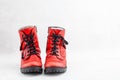 Pair of old leather red discarded boots with laces Royalty Free Stock Photo