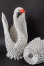 Close-up of a pair of white paper swans. A symbol of love and fi