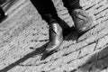 Close up of a pair of worn out shoes with relieved shoe sole