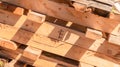 Close-up of palette wood 2x4 beams, for lumber in recycled up-cycled and reclaimed wood projects or furniture. Carpentry wood