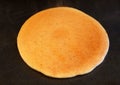 Close up of a pancake on the hot stove