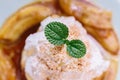 Close up Pancakes with caramel-banana syrup topping with whip cream and mint leaves Royalty Free Stock Photo