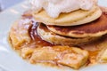 Close up Pancakes with caramel-banana syrup topping with whip cream and mint leaves Royalty Free Stock Photo