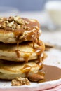 Close up pancakes with caramel and walnuts white background. Romantic breakfast Royalty Free Stock Photo