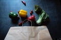 Close up of paper bag with groceries and natural vegetable condiments