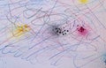 Close-up of a paper covered with a chaotic mixture of black and red scribbles, ink splatters and abstract lines. Royalty Free Stock Photo